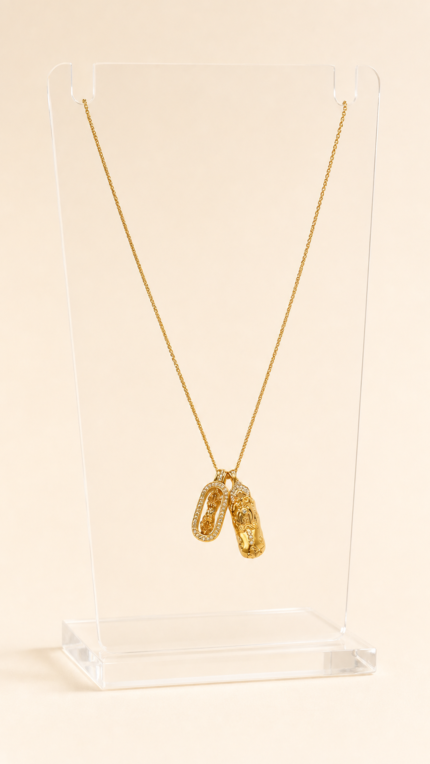 Aurone Pixiu Demon-Subduing Amulet Pendant necklace on a transparent acrylic display stand