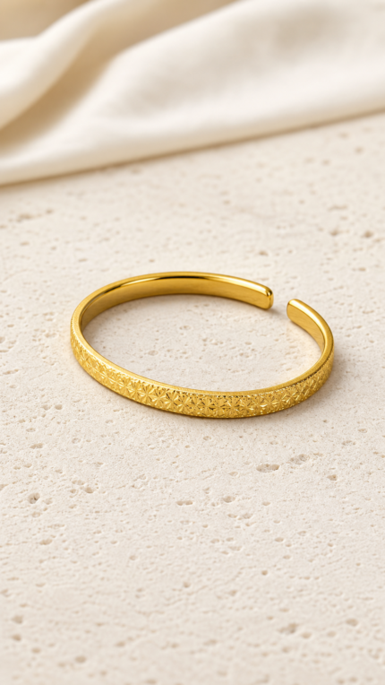 Aurone Ice-Crackle Texture Bracelet lying naturally in a minimalist ivory scene