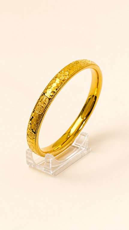 Aurone Fu Character Blessing Bangle centered on a transparent acrylic jewelry stand