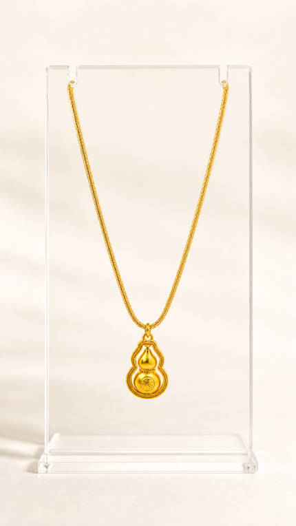 Aurone Fu Character Rotating Gourd Necklace centered on a transparent acrylic display stand