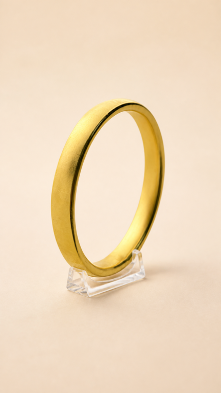 Aurone Tire Tread Bangle centered on a transparent acrylic jewelry stand
