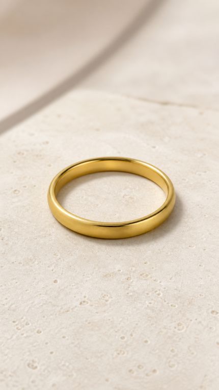 Aurone Tire Tread Bangle lying naturally in a minimalist stone scene