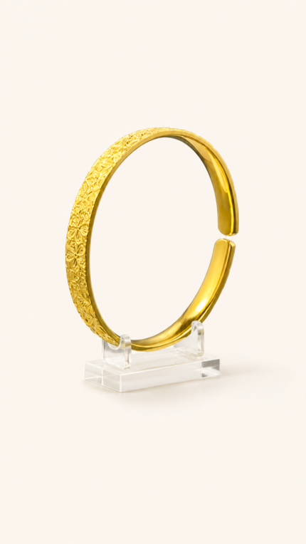 Aurone Sakura Crushed Ice Bangle centered on a transparent acrylic jewelry stand