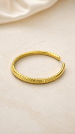 Aurone Sakura Crushed Ice Bangle lying naturally in a minimalist ivory scene