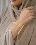 Najma Floral Ridge Bangle worn by an Arab woman