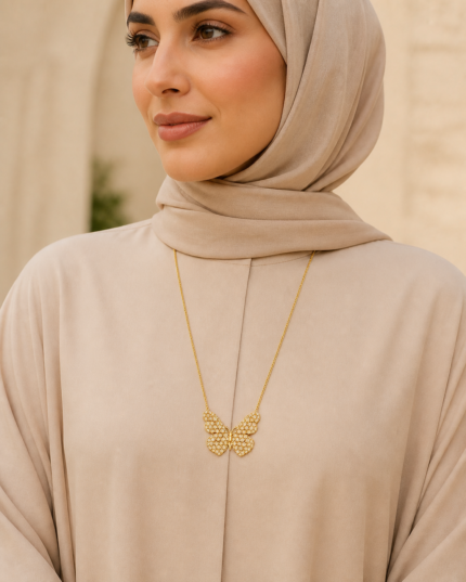 Farasha Butterfly Pendant Necklace worn by an Arab woman